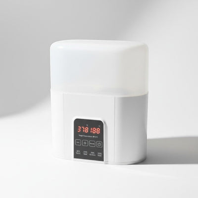 Peek Ah Boo white 4-in-1 baby bottle warmer and sterilizer with digital display and touch controls.