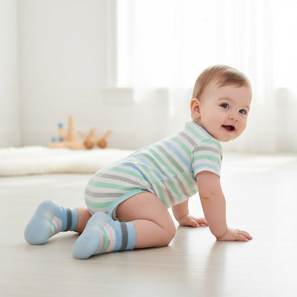 Peek Ah Boo light blue knit baby shoes with grey trim and pastel rainbow stripes, rubber sole.