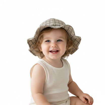 Peek Ah Boo beige linen-blend baby sun hat with black grid pattern and ruffled brim.