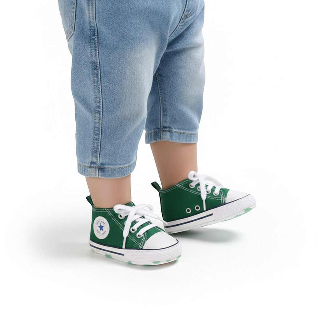 Peek Ah Boo green canvas toddler sneakers with white laces and non-slip soles, ideal for first walkers.