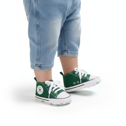 Peek Ah Boo green canvas toddler sneakers with white laces and non-slip soles, ideal for first walkers.