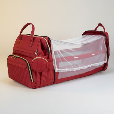 Peek Ah Boo grey multifunctional diaper bag backpack with expandable travel bassinet and mesh sides.