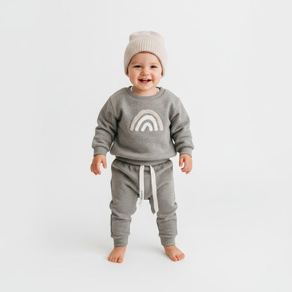 Peek Ah Boo grey ribbed cotton baby sweatshirt with rainbow appliqué and matching pants with drawstring.