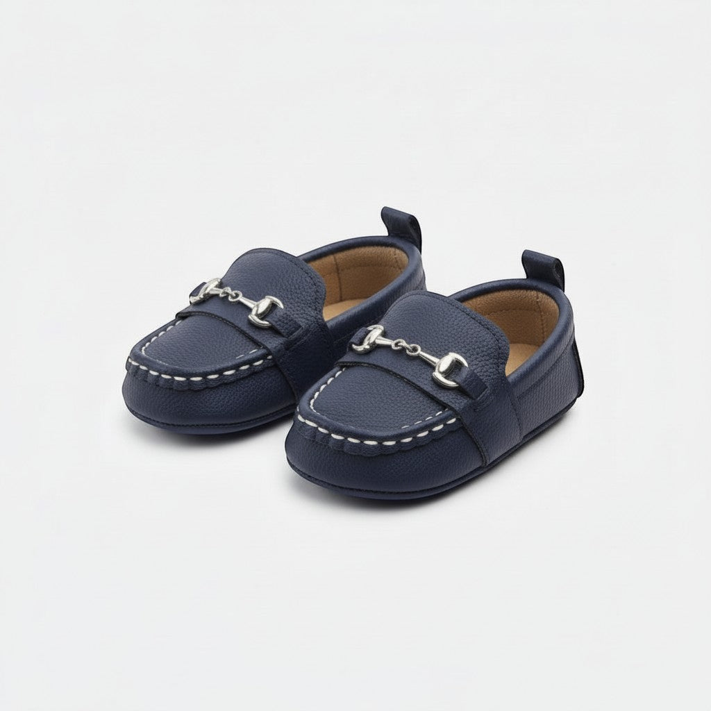Peek Ah Boo navy blue leather baby loafers with silver bit detail and white stitching. Elasticated opening for easy wear.