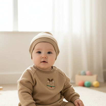 Peek Ah Boo tan baby bodysuit with reindeer embroidery and matching hat with antlers. Soft cotton blend, perfect for holidays.