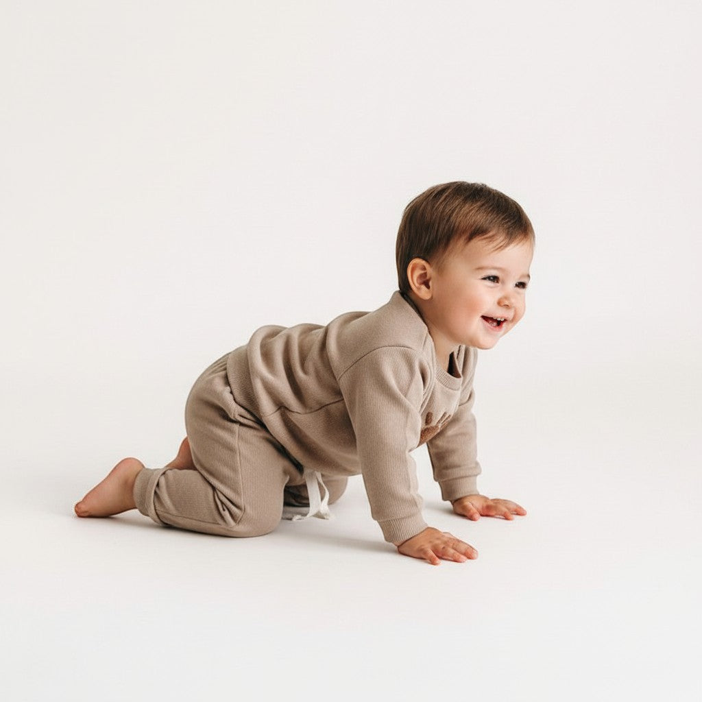 Peek Ah Boo tan ribbed cotton baby set with long-sleeve sweatshirt featuring a sun applique and matching pants.