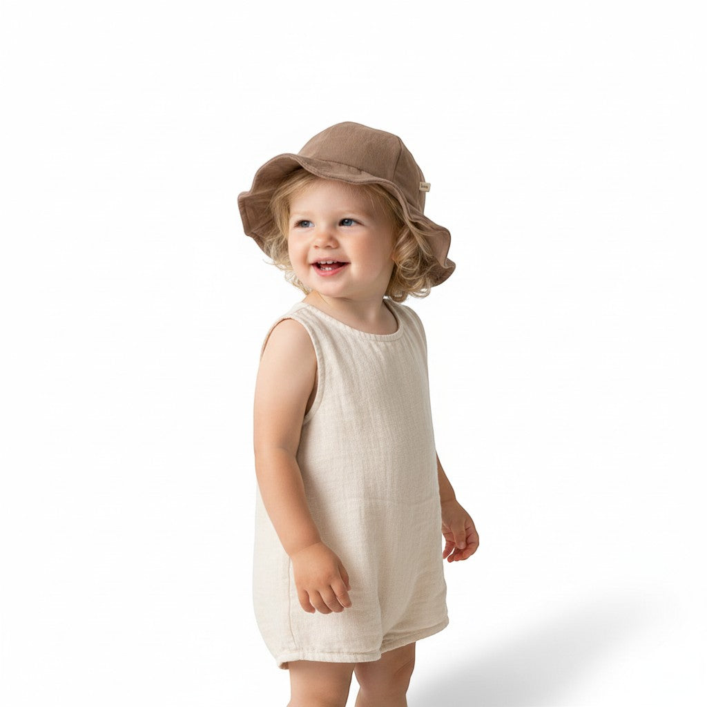 Peek Ah Boo wide brim baby sun hat in taupe, made from breathable fabric with a decorative bow detail.