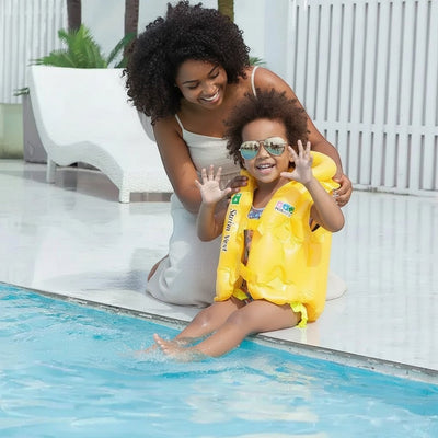 Peek Ah Boo yellow inflatable baby swimming life vest with adjustable safety buckles and triple-chamber buoyancy for pool or beach.